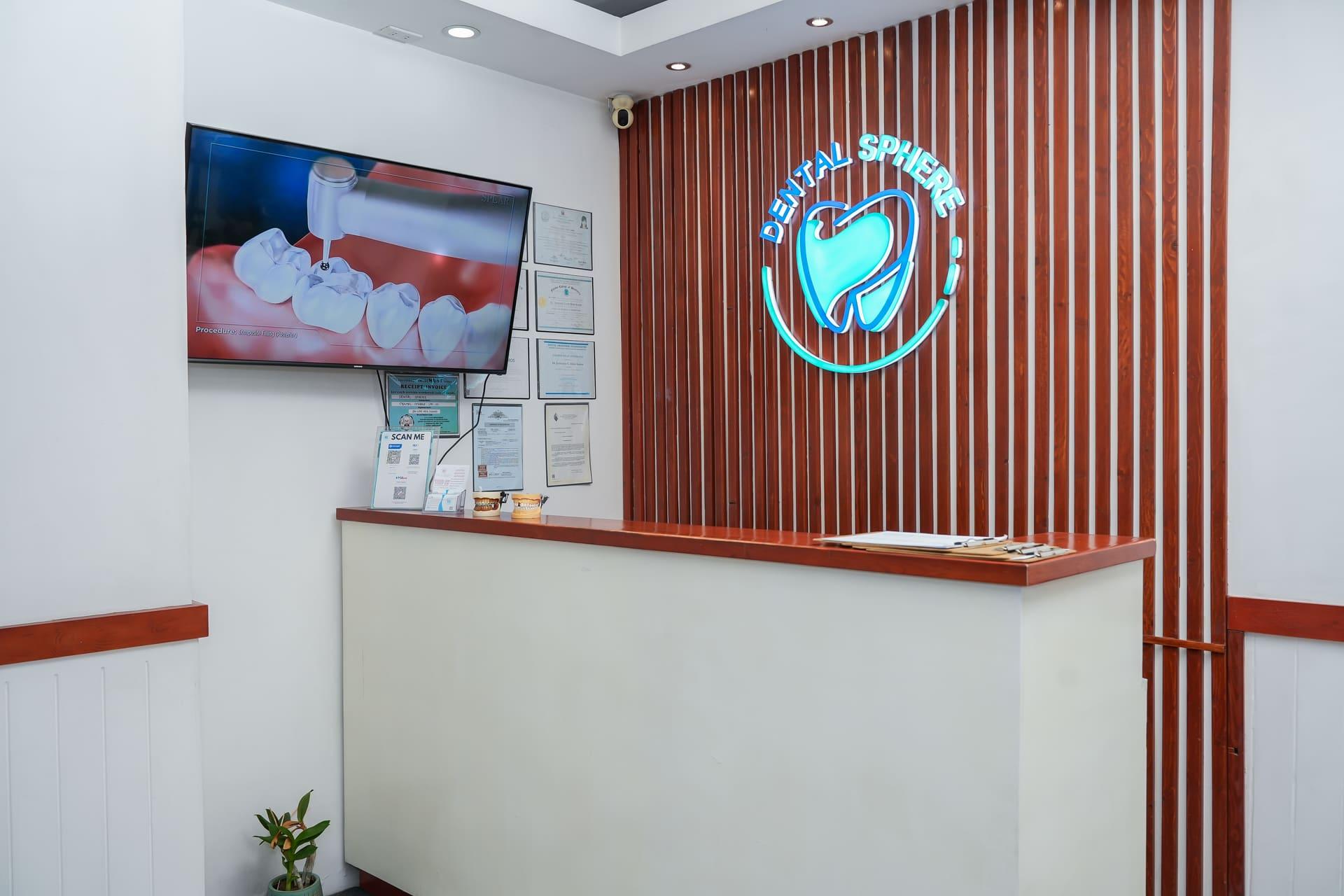 Dental Sphere reception with the glowing clinic logo
